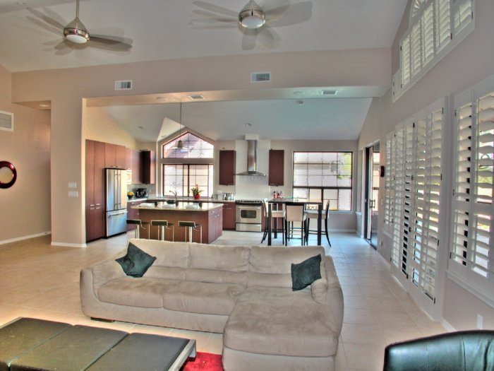 This open concept floor plan blends the great room and kitchen to make an ideal space for entertaining. (Photo courtesy of NancyHugo.com)